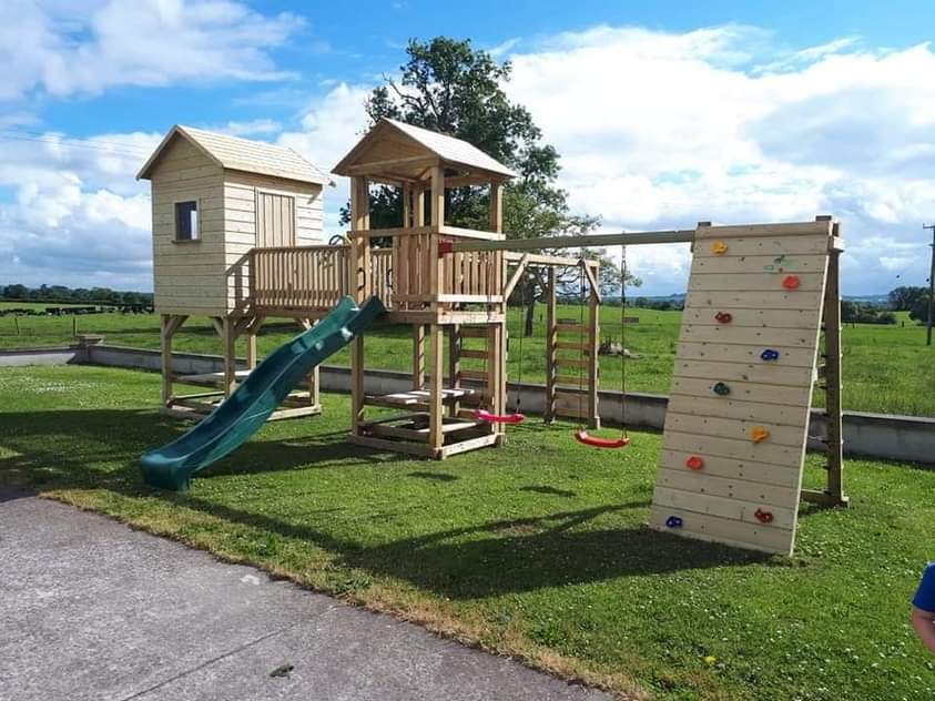 260- 5x5 Wendlyhouse with tower, Slide, Swings and Rock Climbing